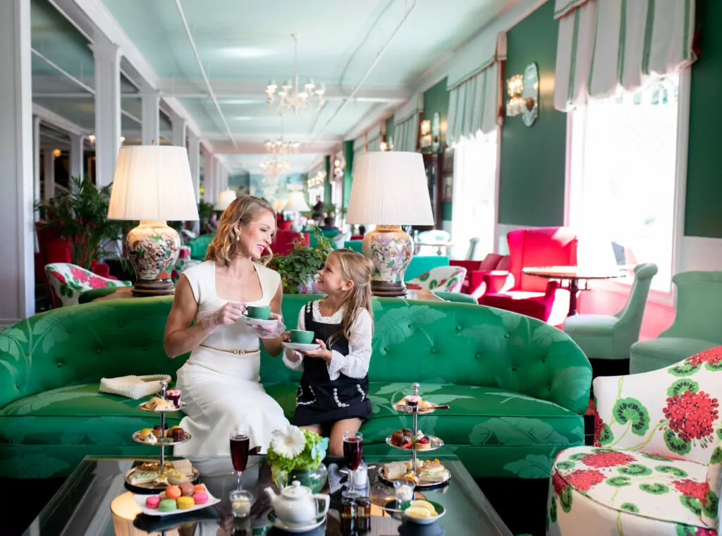 A mother and daughter enjoying a nice tea and sweets at a upscale hotel - The Grand Hotel Hospitality Marketing