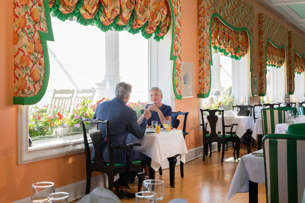 A older couple having a nice linch by in an upscale hotel - The Grand Hotel Hospitality Marketing