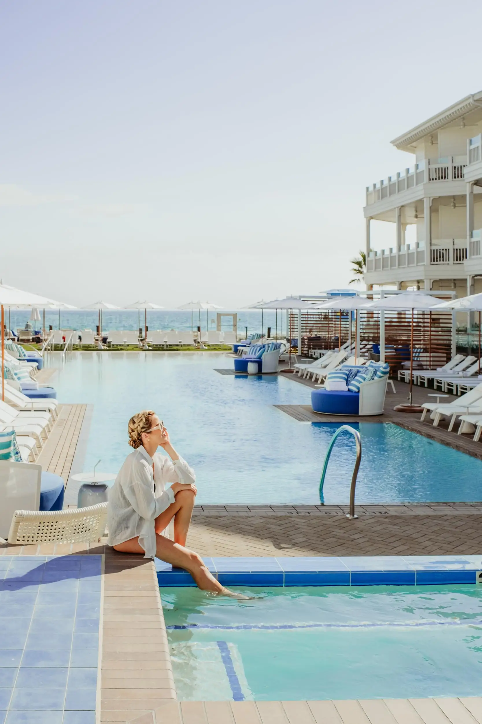 A young woman enjoying the pool at a beach side resort - Hotel Photography - Shore House at the Del